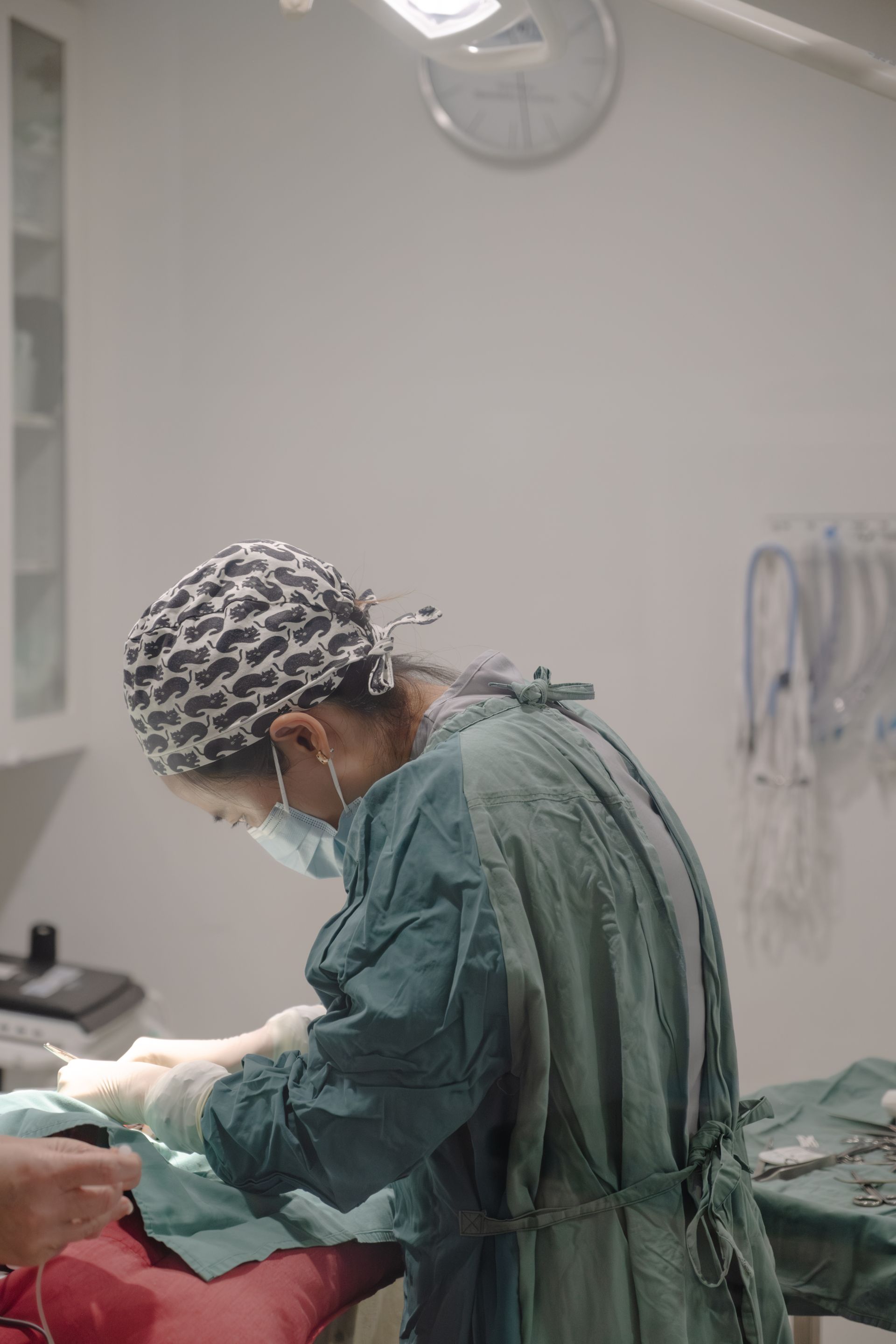 Two Women are Standing next to a Surgical table in an Operating room — Northern Illawarra Veterinary Hospital