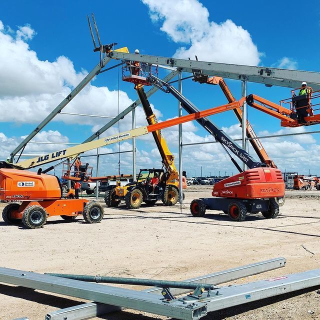 A jlg lift is being used on a construction site