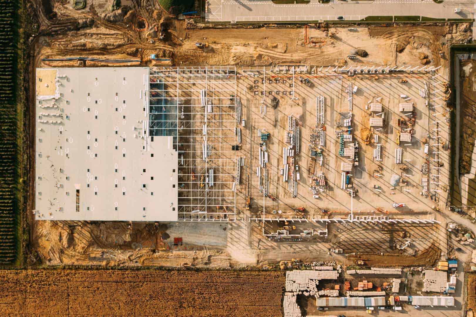 An aerial view of a large building under construction.