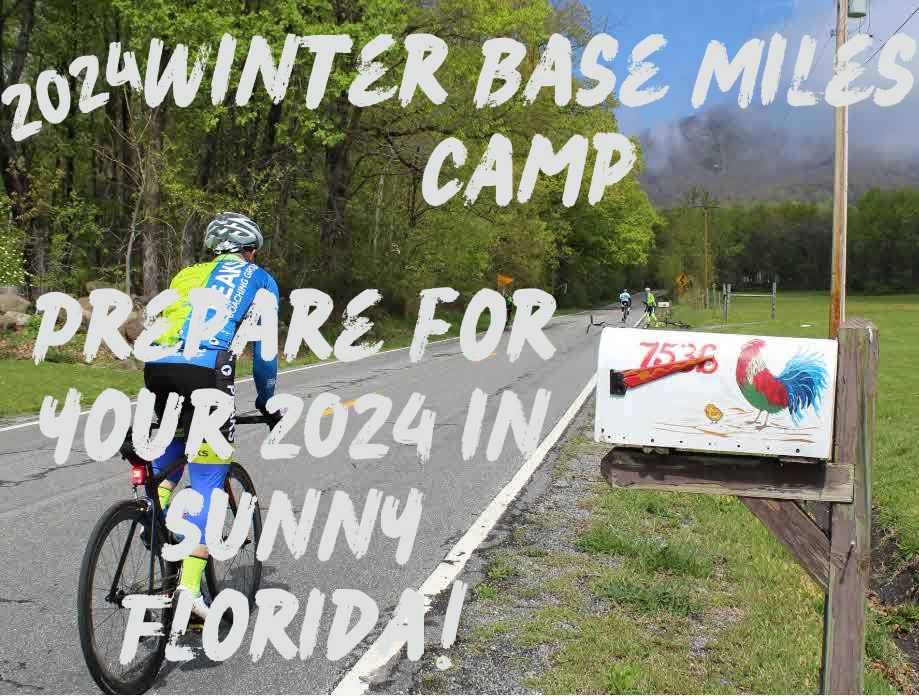 A person is riding a bike down a road with a sign that says prepare for your 2024 in sunny florida