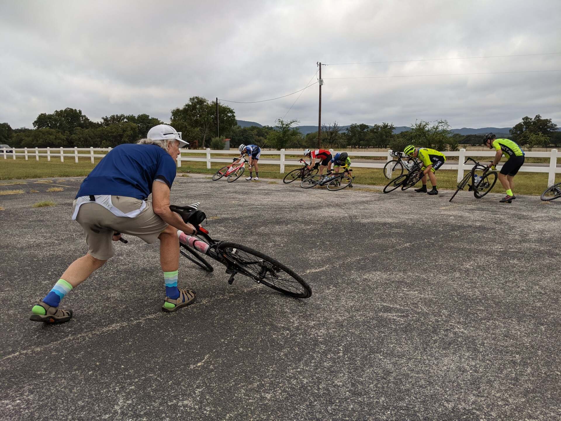 A group of people are riding bicycles down a road.