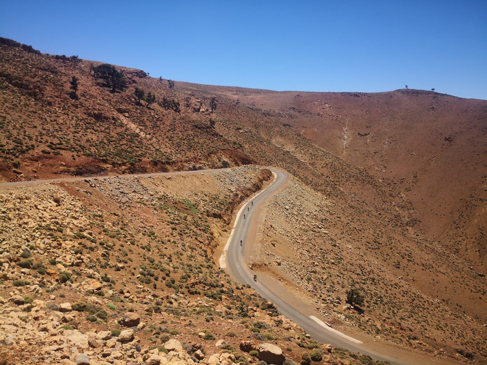 A road that is going through a desert landscape