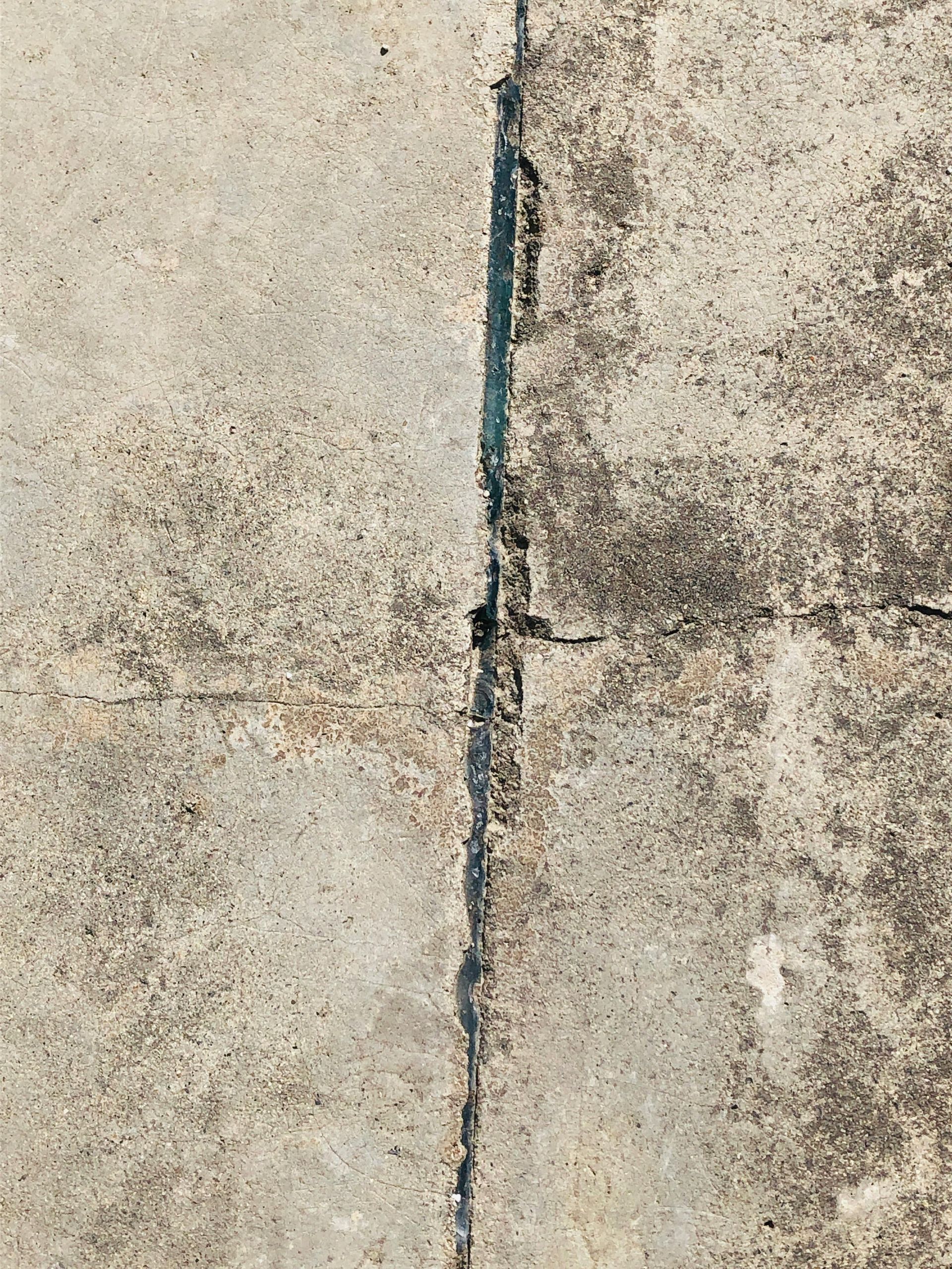 Foundation crack repair process inside partially finished basement area