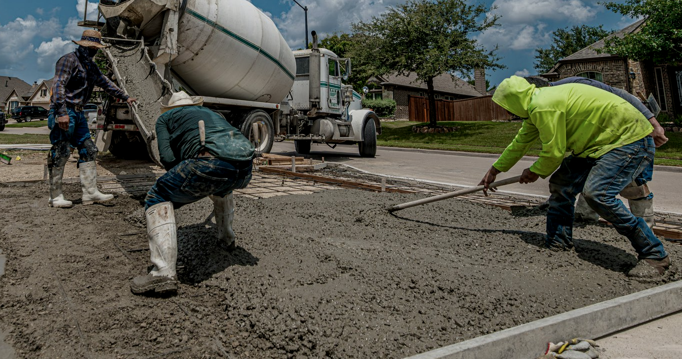 Concrete crew pouring a new residential driveway in Riverhead, New York