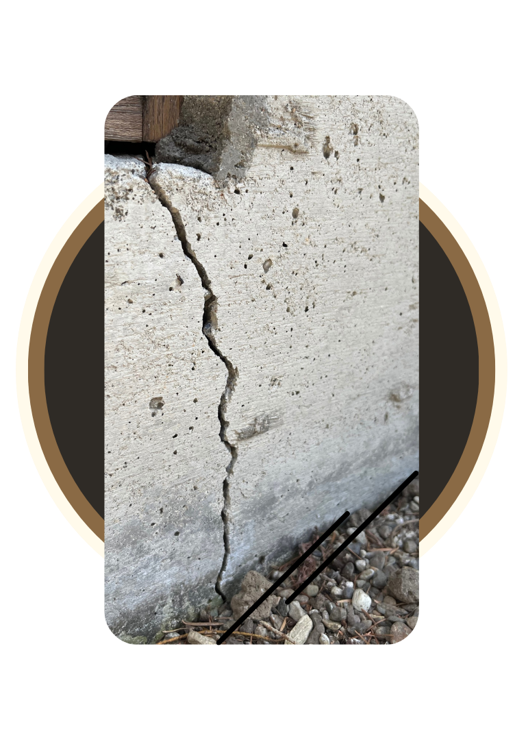 Workers repairing cracked concrete slab foundation beside residential garage