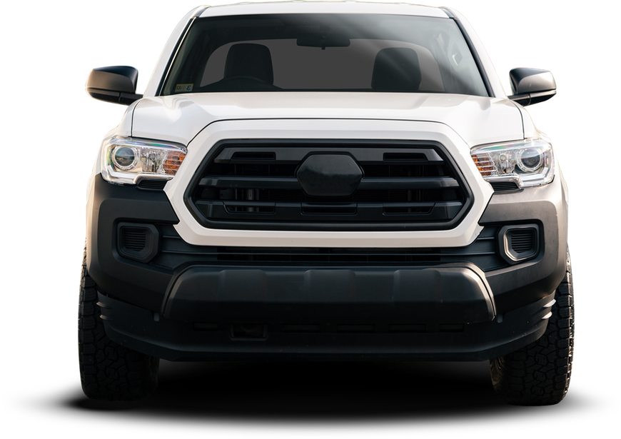 White Toyota pickup truck, black grill and bumper, on a white background.| Crutcher's Auto Repair