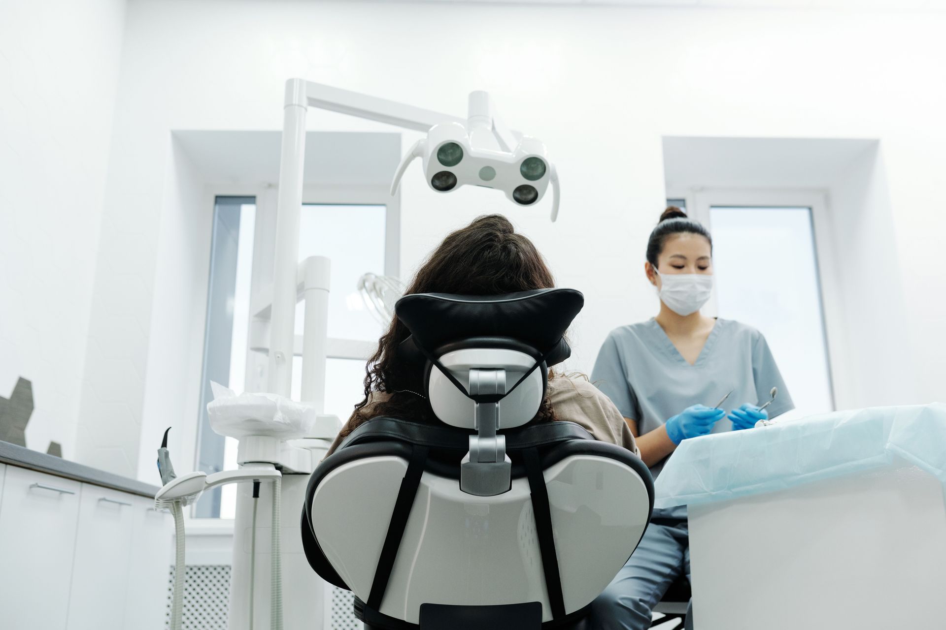 Person waiting for treatment in dental chair