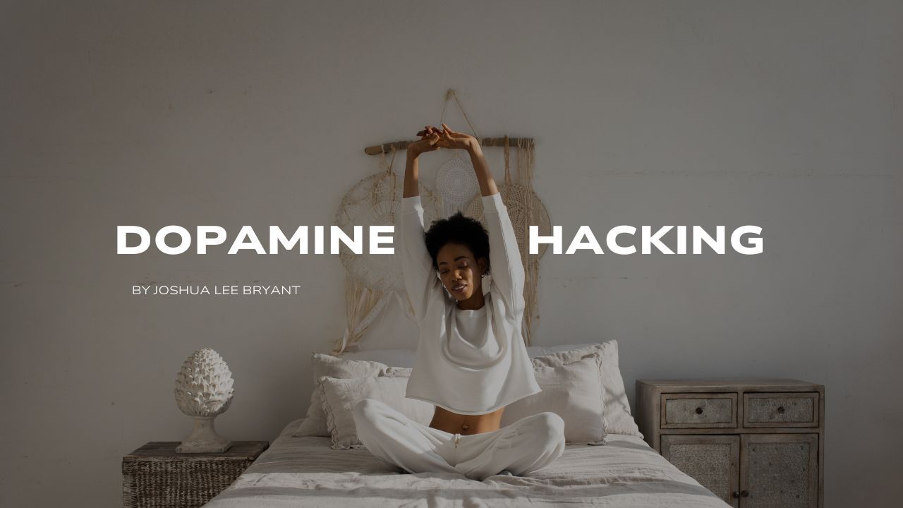 A woman is sitting on a bed with her arms outstretched.