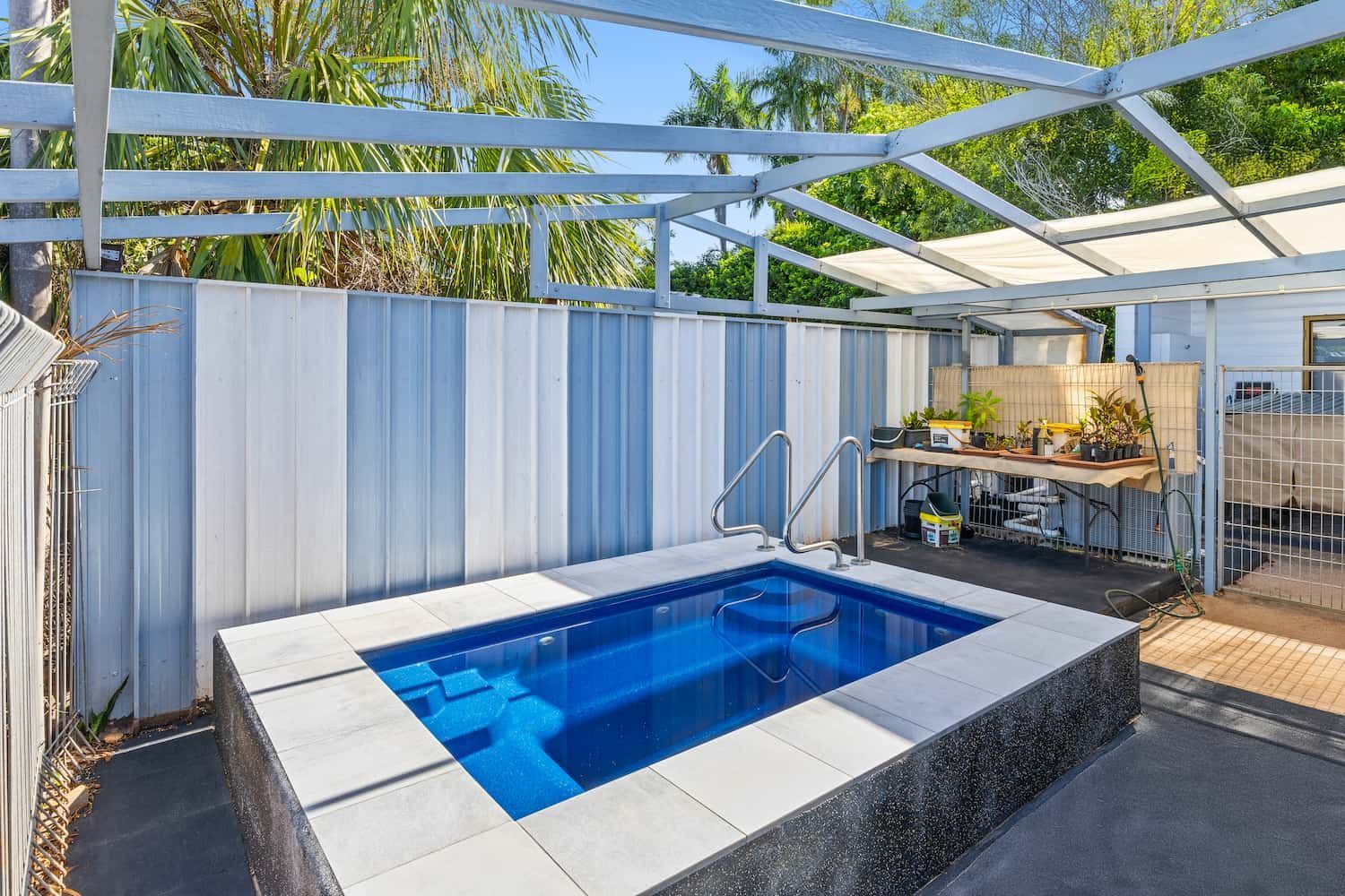 A Small Swimming Pool in the Backyard of a House — Pooltech NT In Alawa, NT