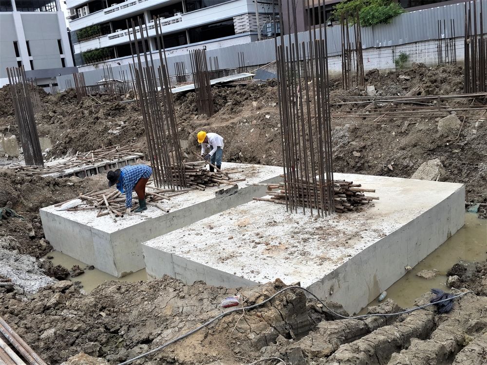 Construction Site: Workers Near Concrete Foundation — BC Earthmoving & Civil Construction in East Barron QLD