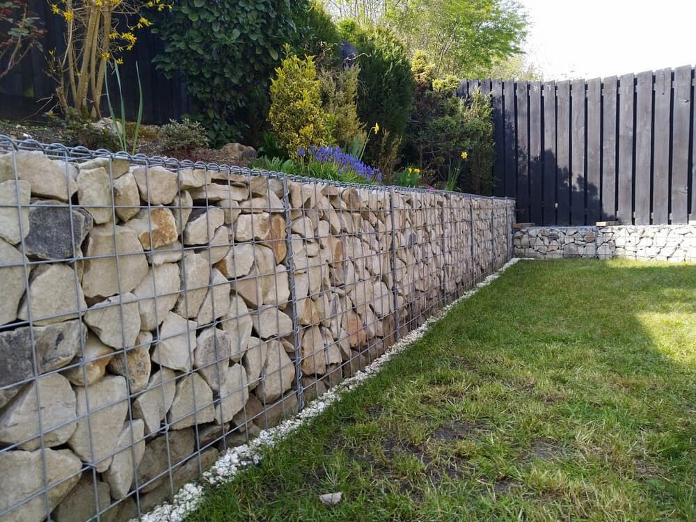 Gabion Retaining Wall Filled With Light-coloured Stones — BC Earthmoving & Civil Construction in East Barron QLD