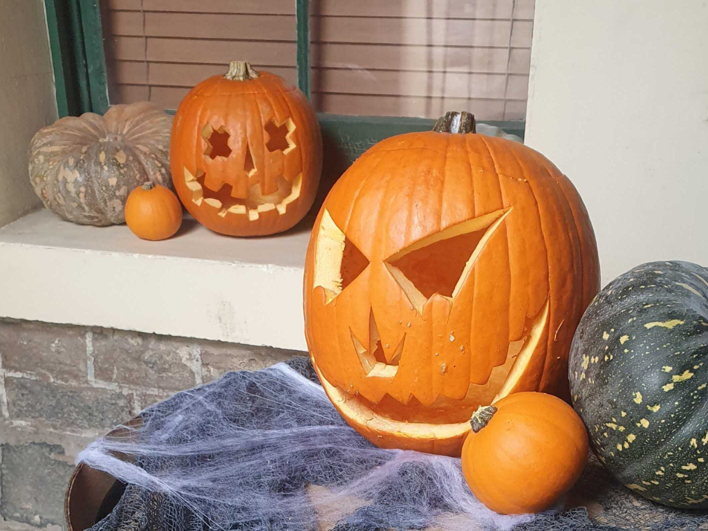 A pumpkin with a face carved into it