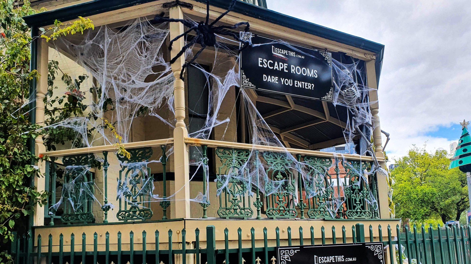 Exterior of Escape This Northbridge covered in decorative cobwebs for Halloween.