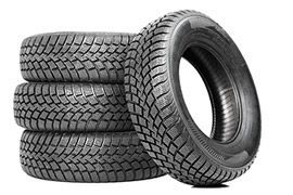 Stack of four black tires, with one tire leaning in front on a white background | Sunshine Service Automotive Specialists