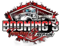 Logo for Booming's Towing & Repair, featuring a tow truck in front of a red and gray graphic design.