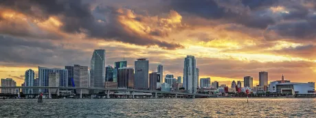 Evening light over Miami during a sunset boat ride with open water views.
