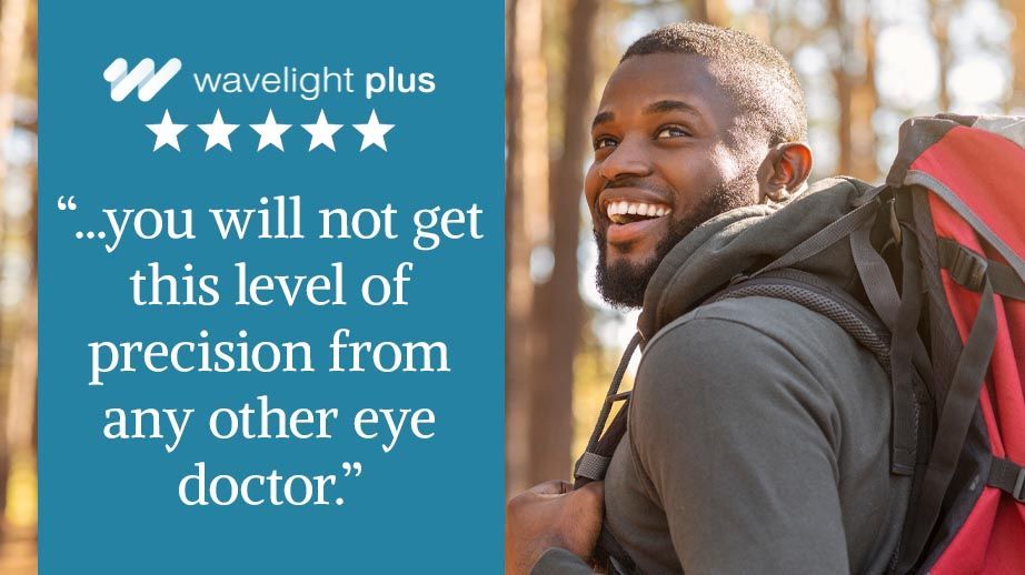 A young man hikes in the woods. A 5 star review for wavelight plus overlays the image.