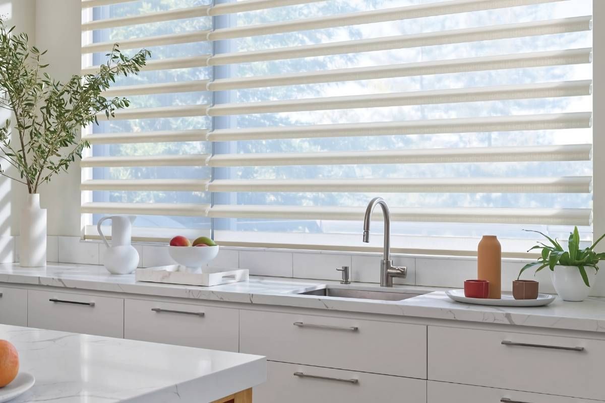 Hunter Douglas Pirouette® Sheer Shades on a kitchen skink window at Advantage Blinds near Prosper, Texas (TX)