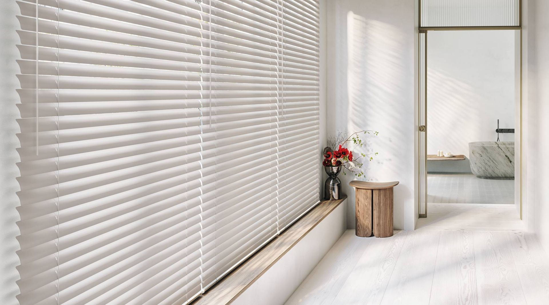 Hunter Douglas Modern Precious Metals® Mini Blinds on a large window in a minimalist home