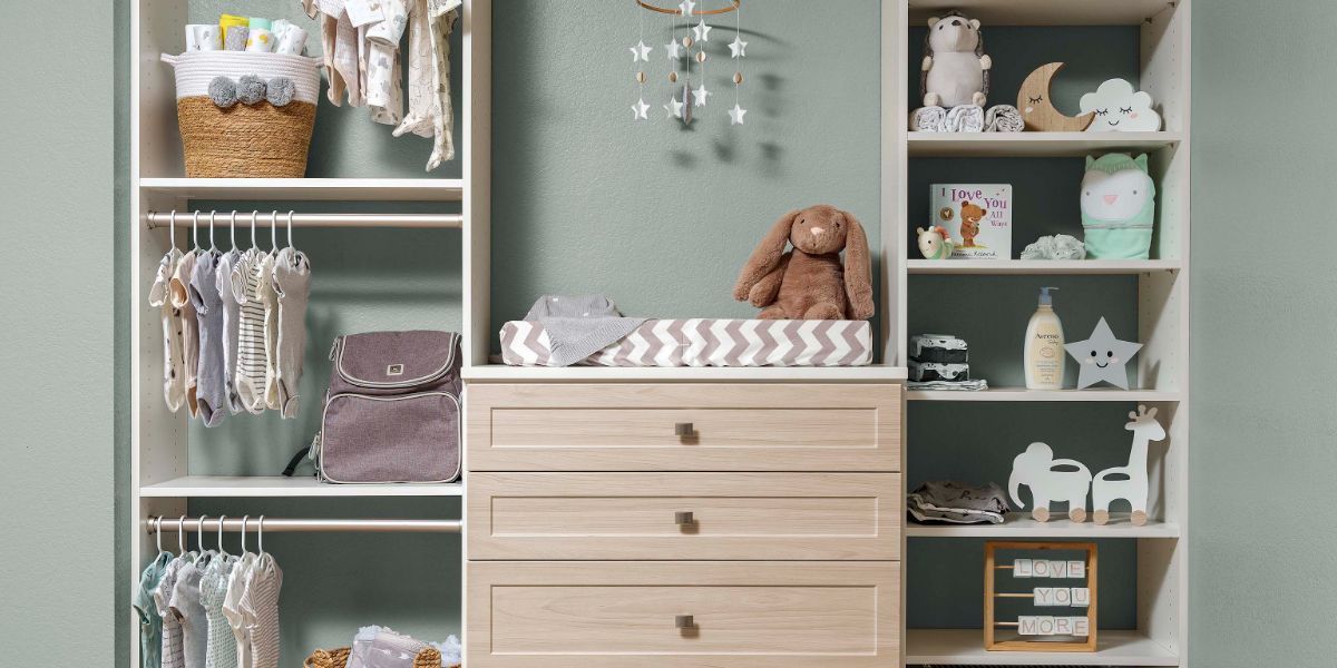 A kids custom closets room with a dresser , shelves , and a changing table.