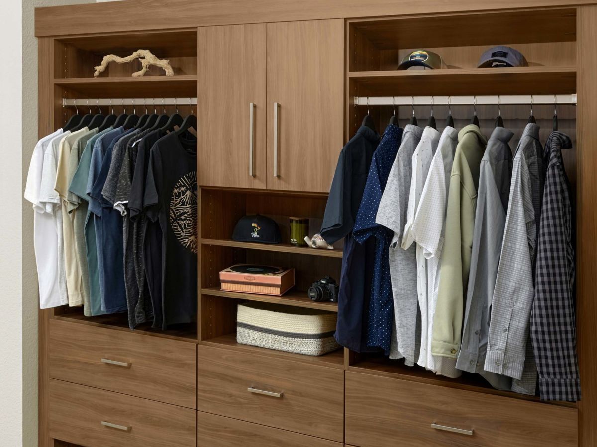 A Tahoe color style closet filled with lots of clothes and hats