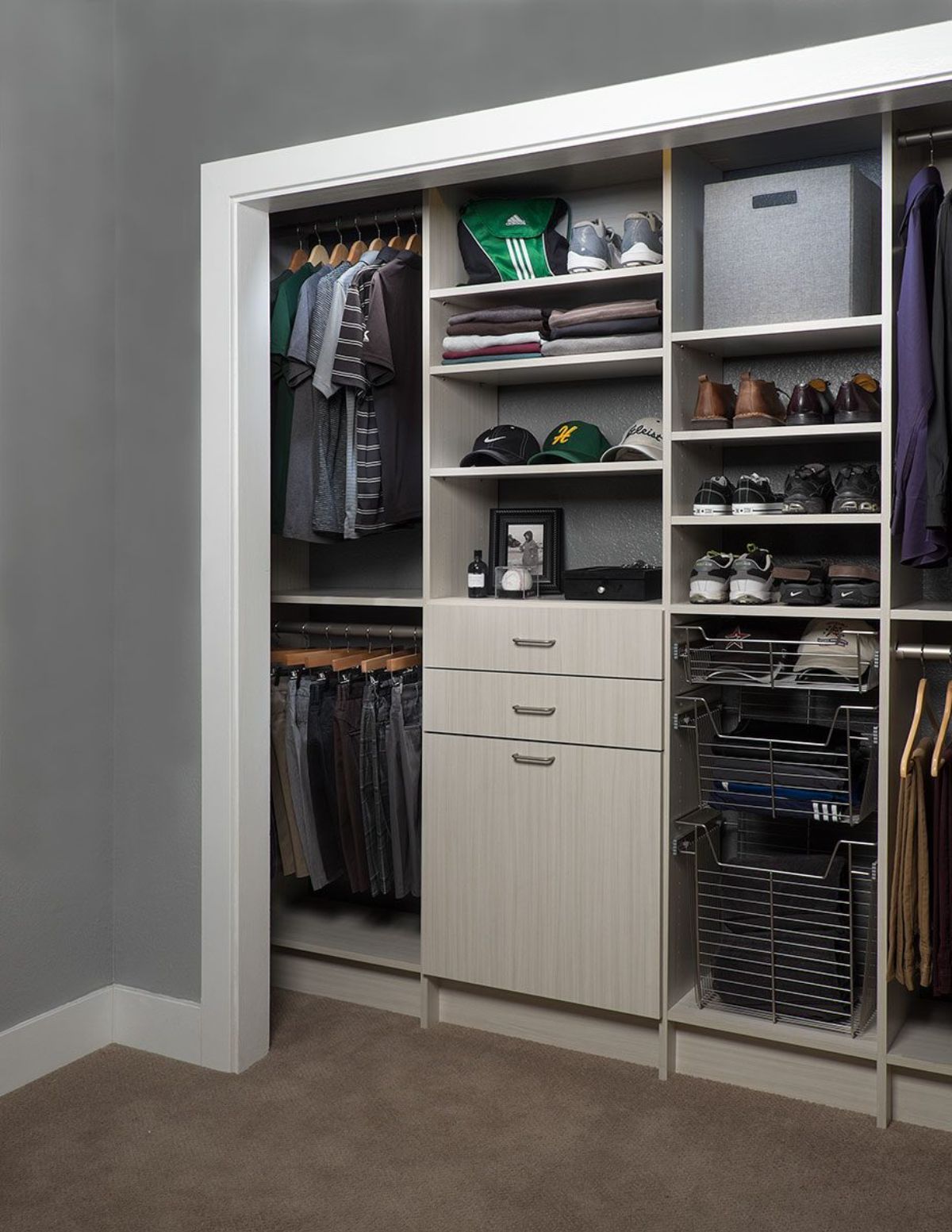 A walk in closet with lots of clothes and shoes