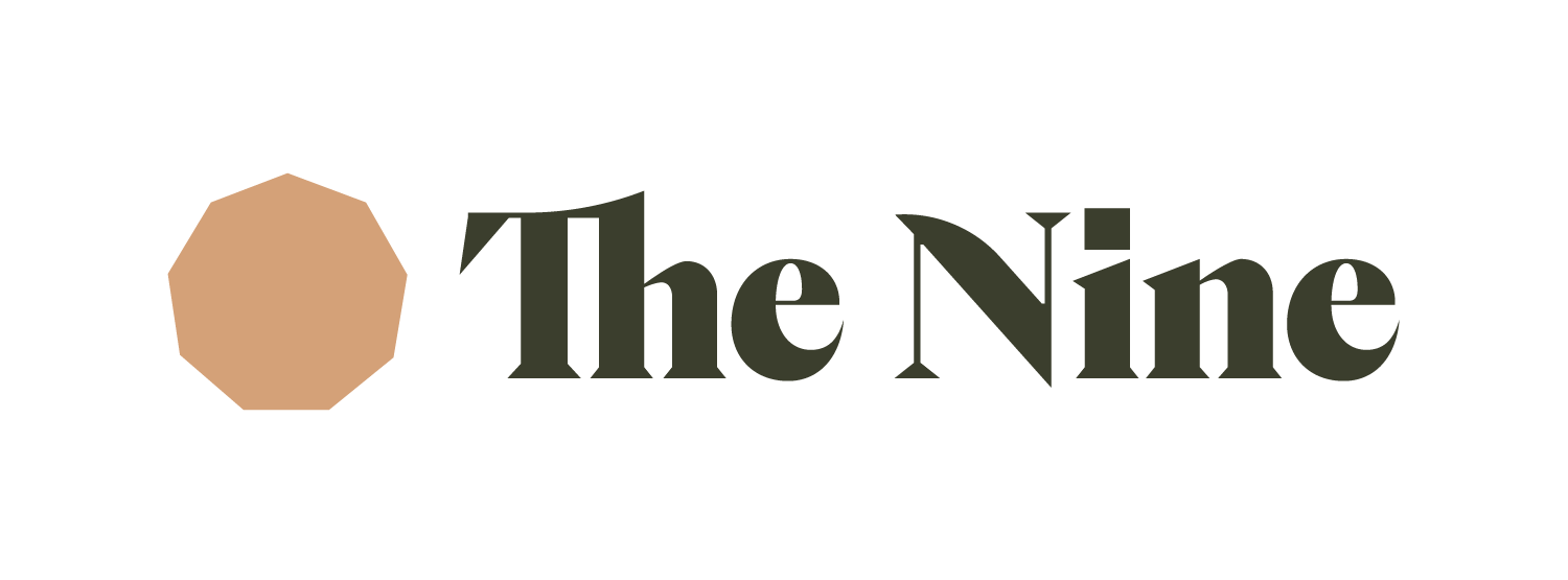 Logo reading “The Nine” with a tan octagon icon to the left on a white background