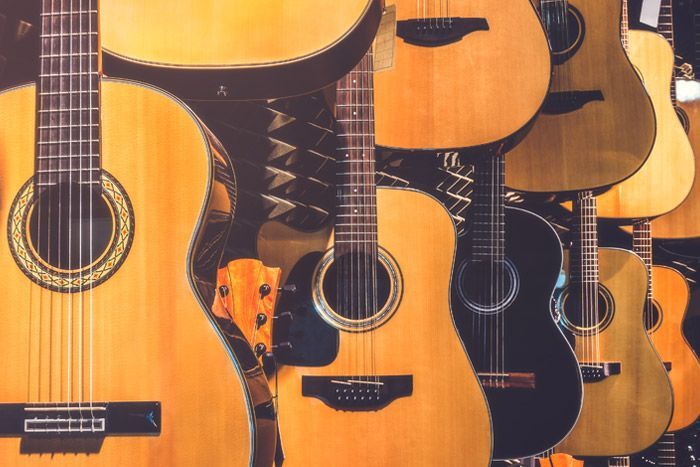 Close-up of several acoustic guitars