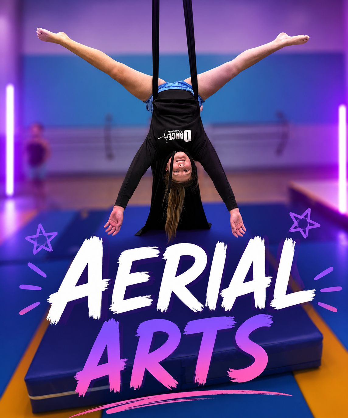 Aerial performer upside down on silks in a purple-lit studio with “AERIAL ARTS” text.