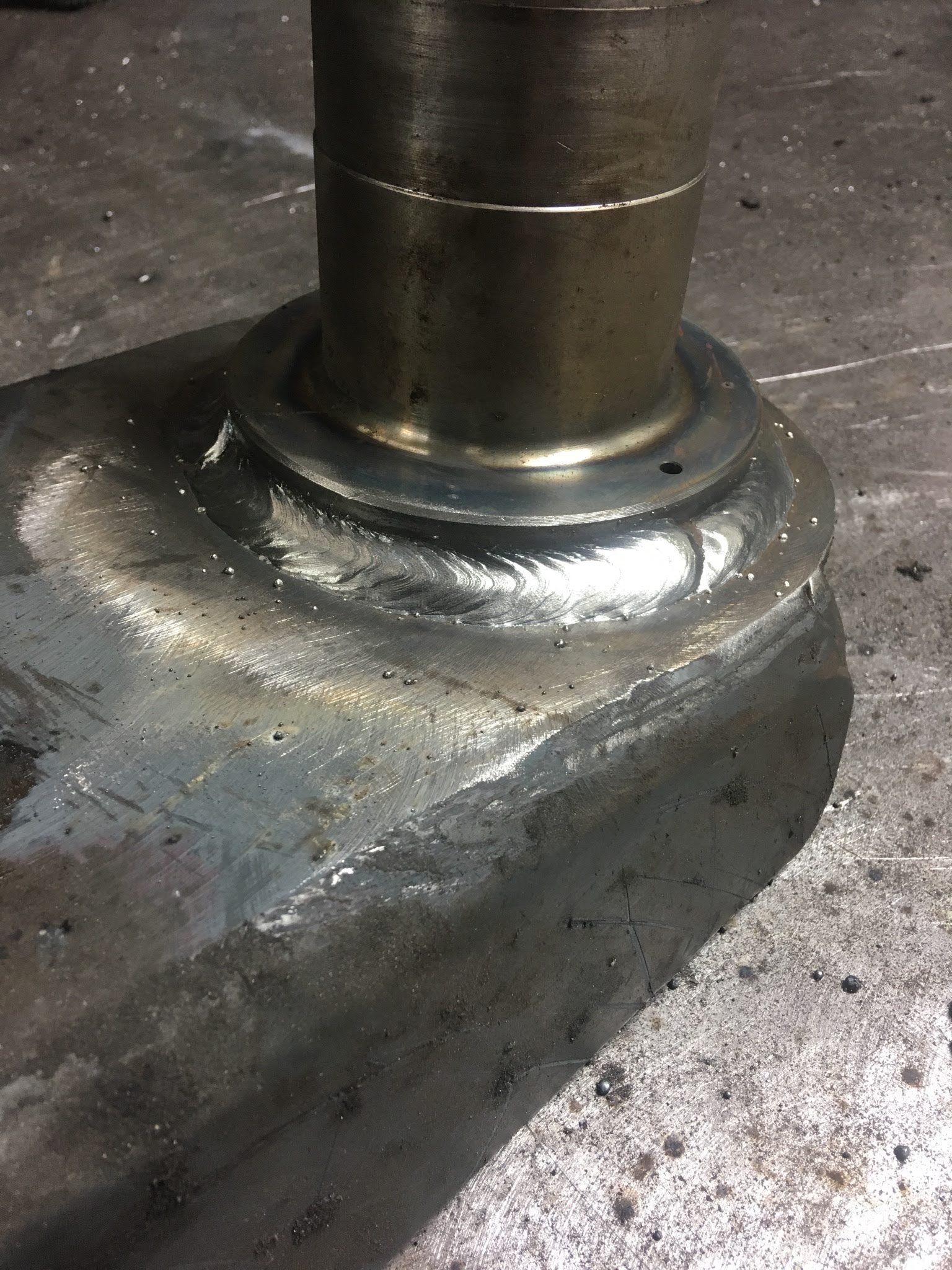 A close up of a metal object with a hole in it.