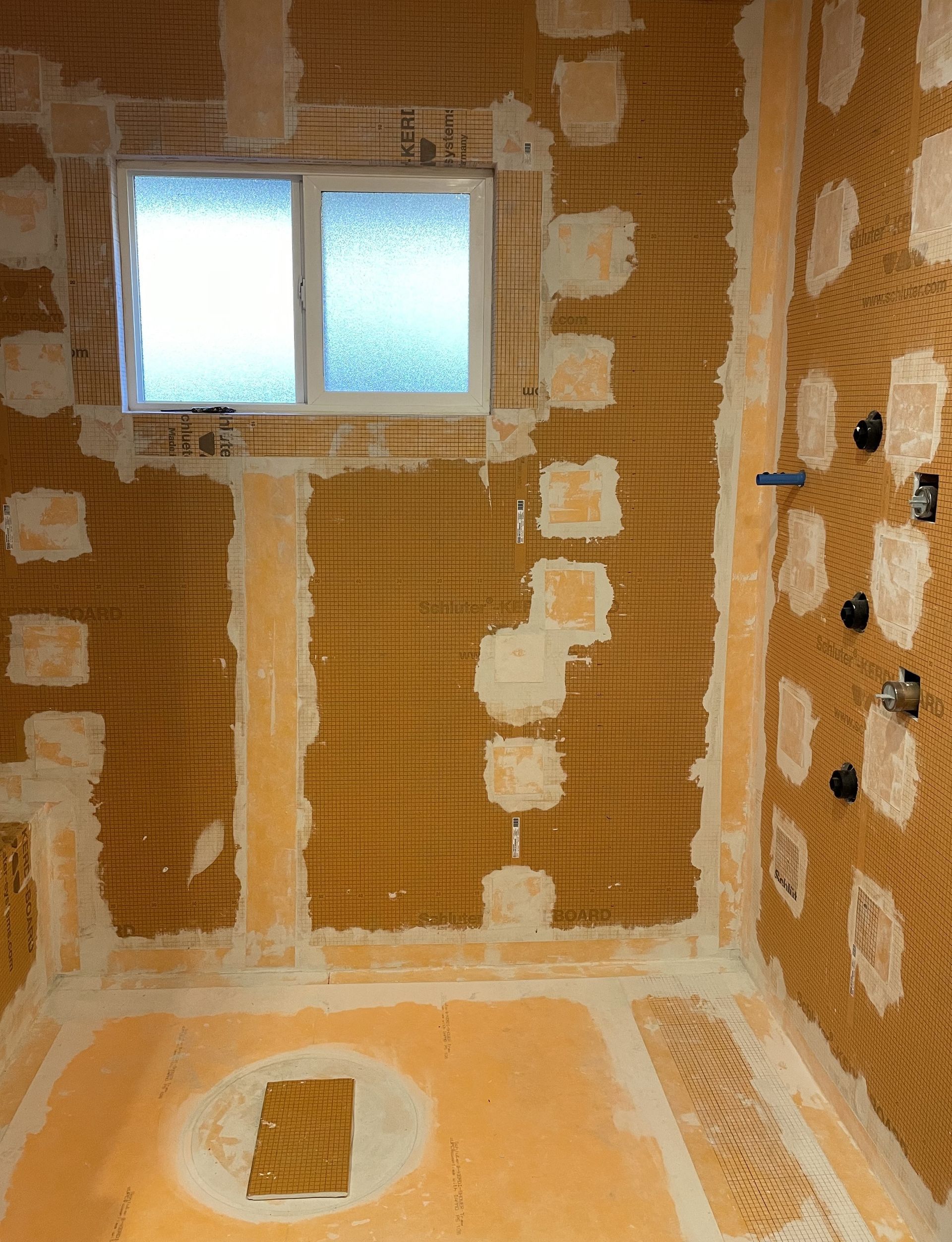 Rightway Plumbing Sewer And Drain - A bathroom under construction with a window and a hole in the floor
