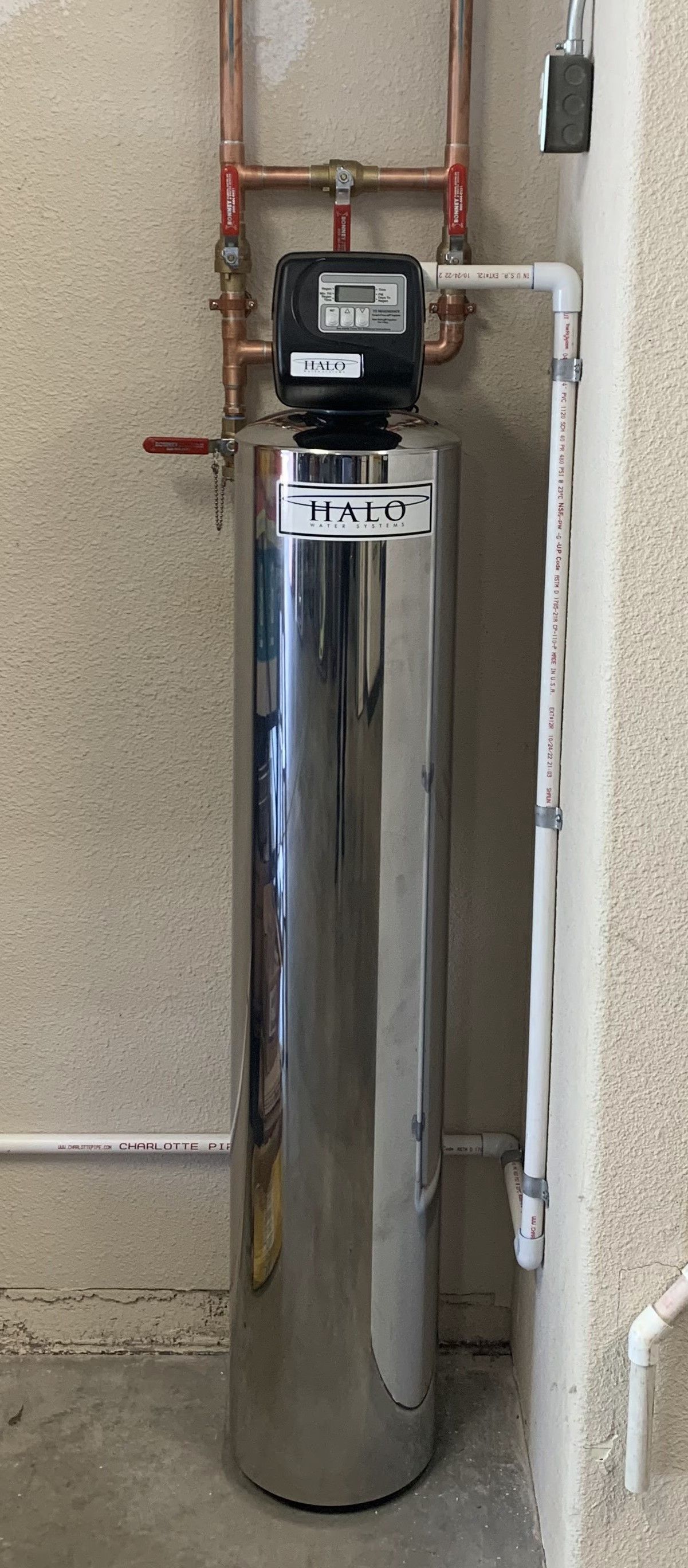 Rightway Plumbing Sewer And Drain - A stainless steel water filter is attached to a wall.