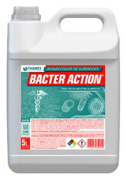 Jarra blanca de 5 litros de limpiador BACTER ACTION con asa y etiqueta roja y verde.