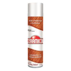 Lata de aerosol blanca y morada con etiqueta naranja, mostrada sobre un fondo liso.