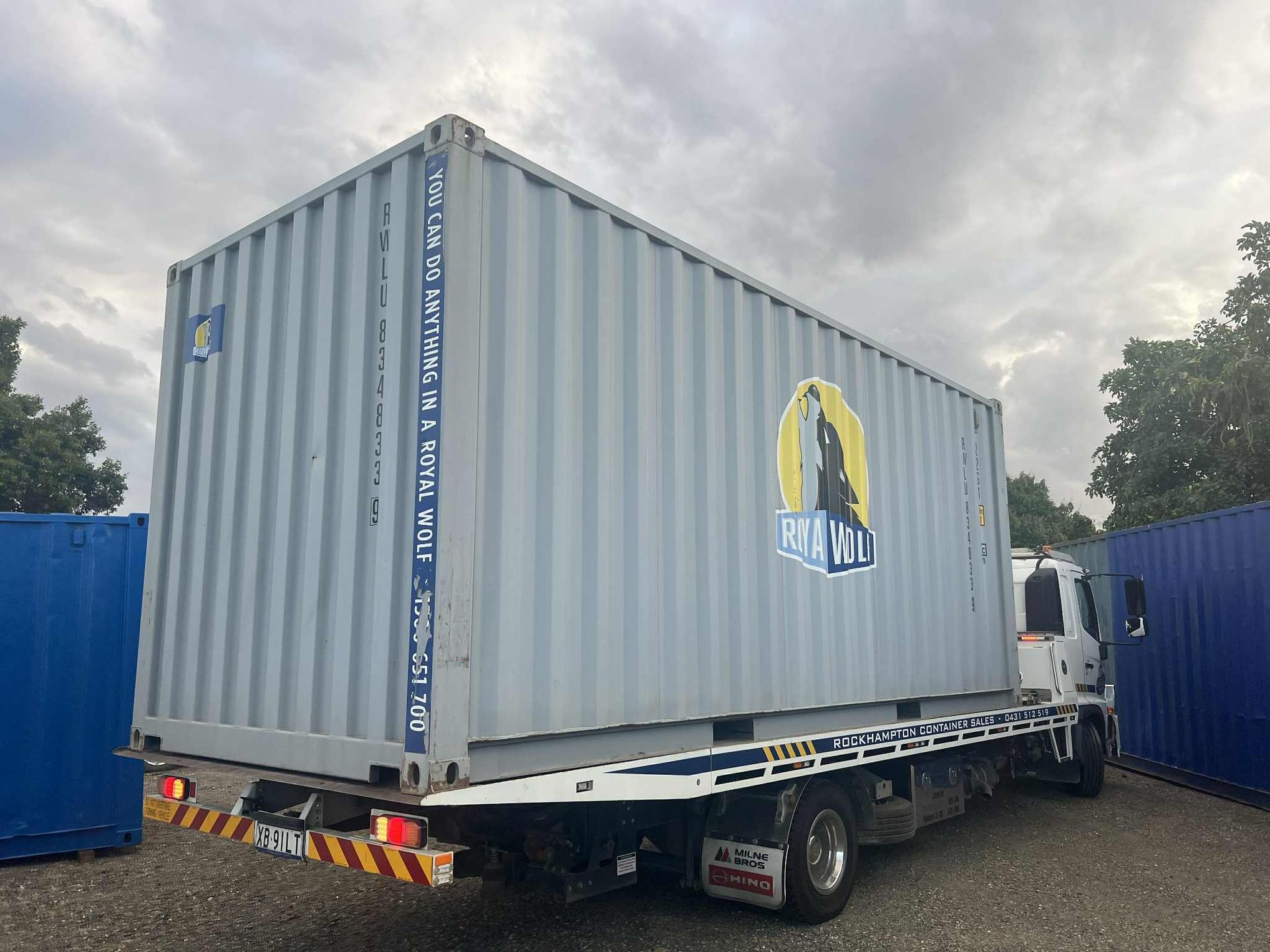 a Light Blue Shipping Container on a Flatbed Truck  — Rockhampton Container Sales in Kawana, QLD
