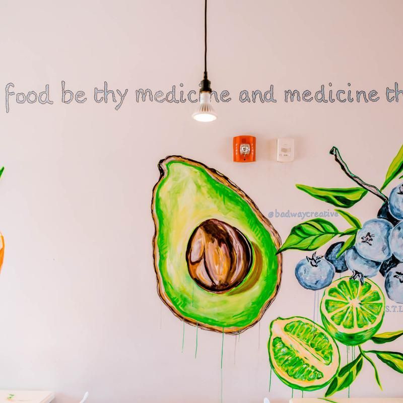 Wall mural with avocado, blueberries, and lime beneath the quote “Food be thy medicine and medicine thy…”