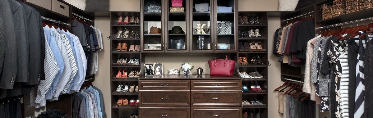 a spacious walk-in closet with two dressers, perfect for a couple's storage needs.