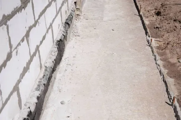 Concrete foundation wall with footer.