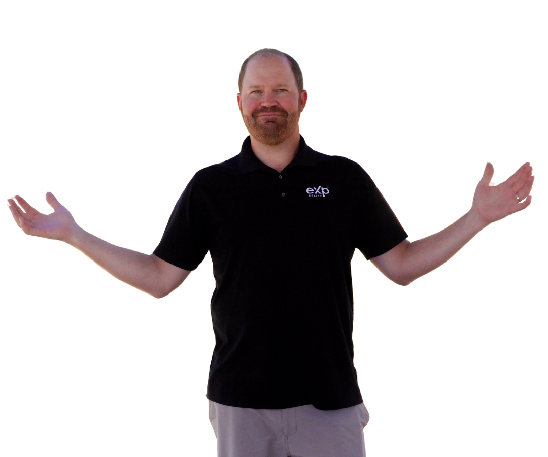 A man in a black polo shirt is standing with his arms outstretched