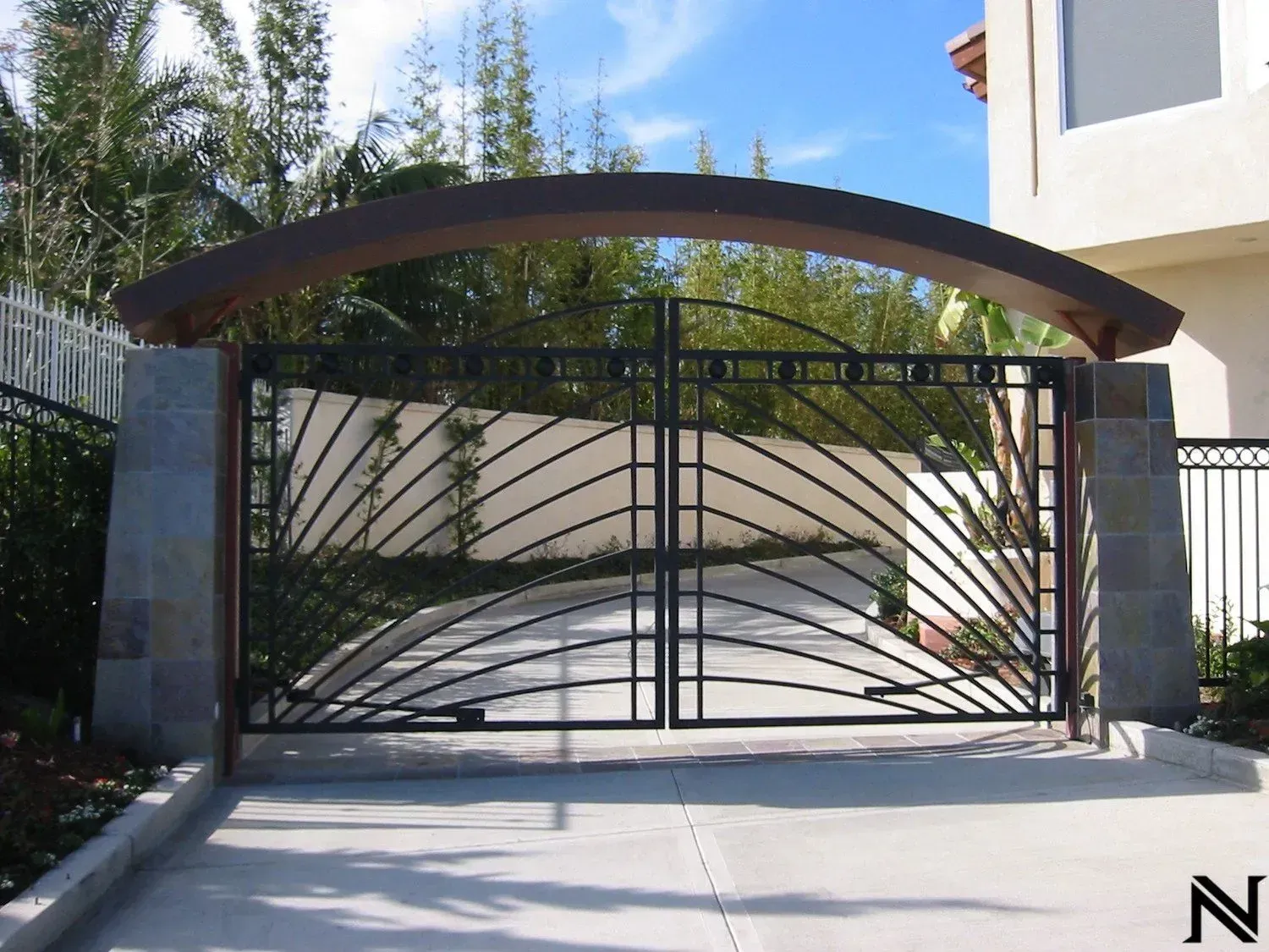 A wrought iron gate with the letter n on it