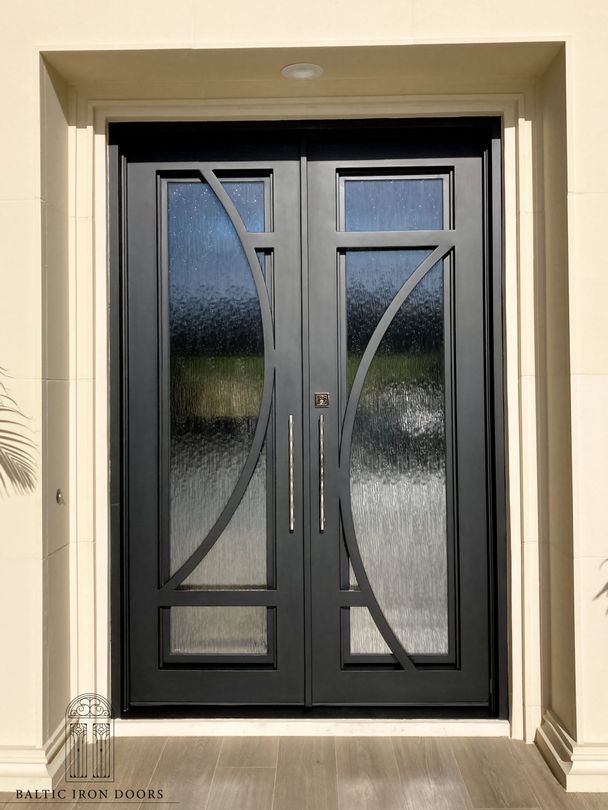 A wooden door with a wrought iron design on it