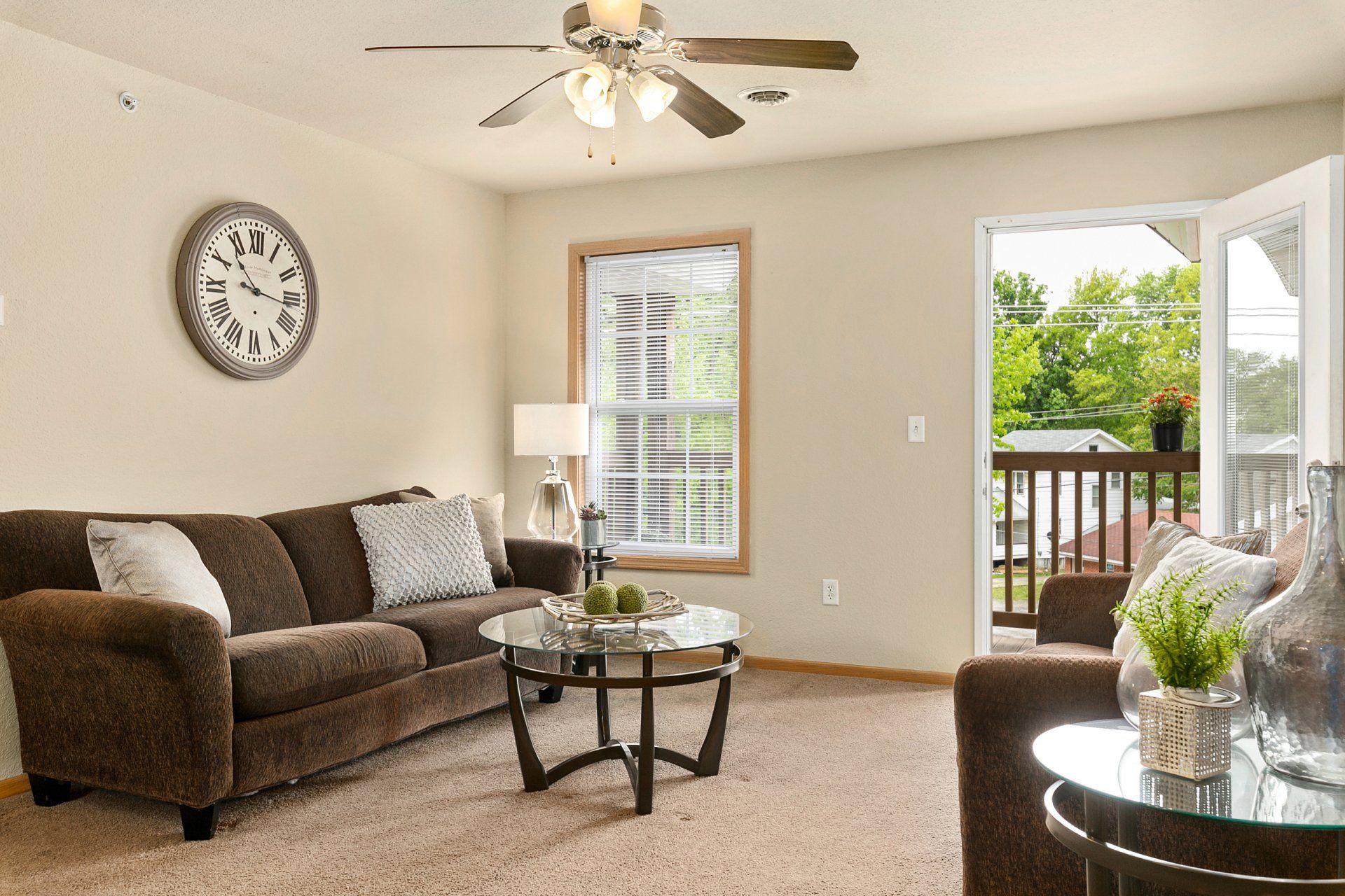 Fully furnished living room with couch, love seat, coffee table