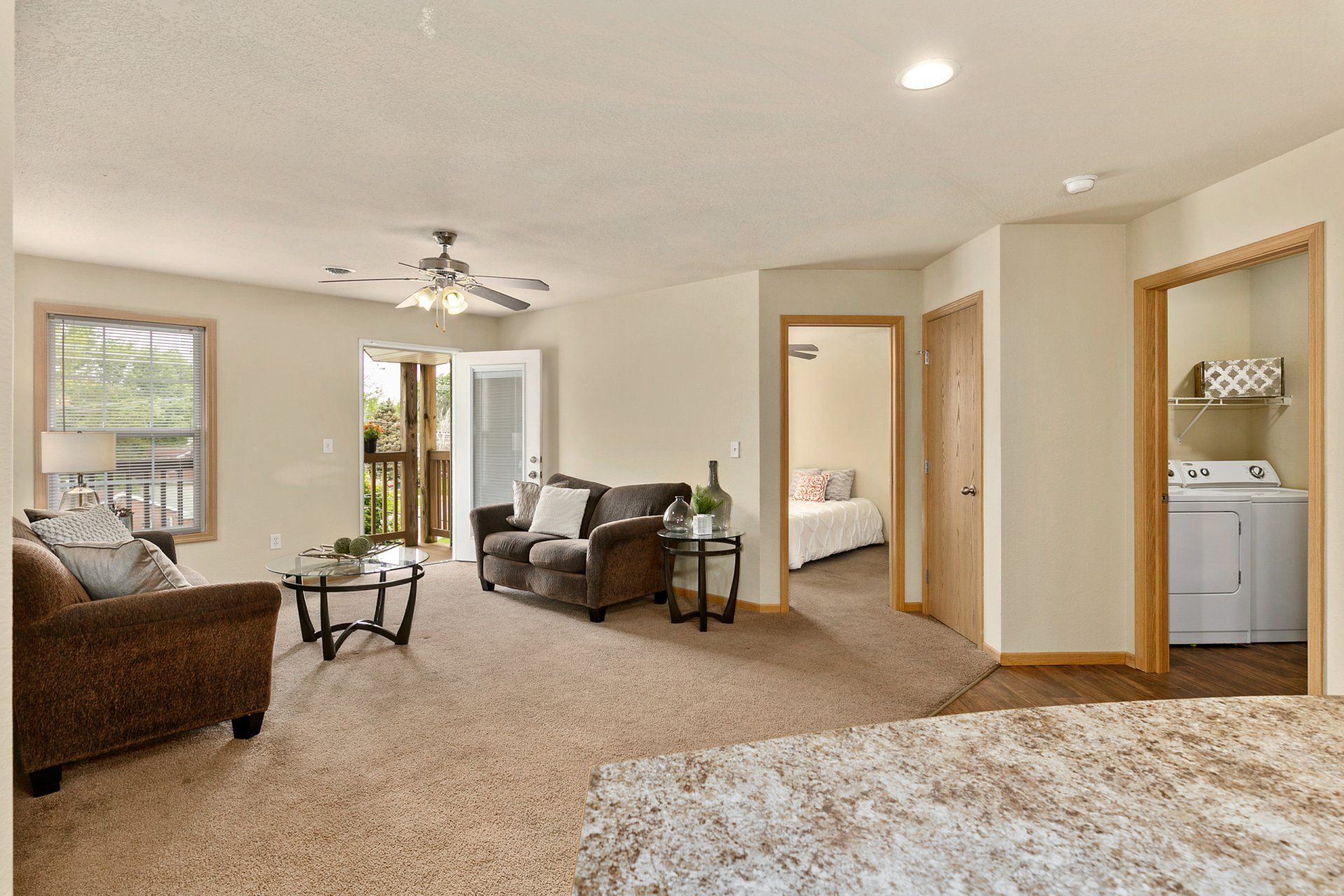 Fully furnished living room with couch, love seat, coffee table