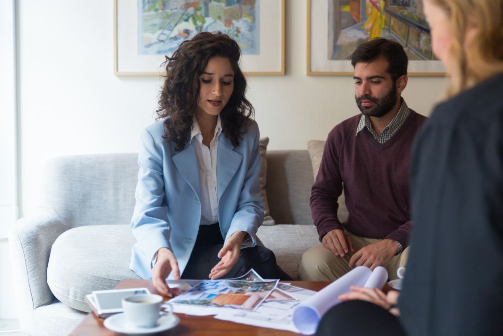 Professional real estate appraiser discussing property details with client.