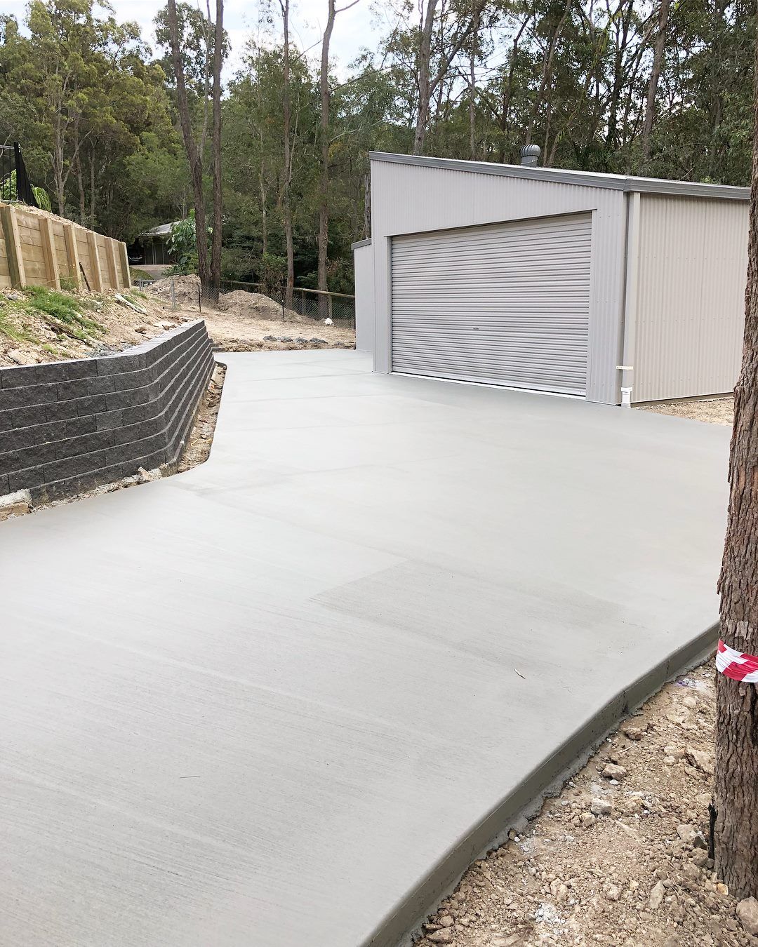 Newly Poured Grey Concrete Driveway — Sand & Stone in Worongary, QLD