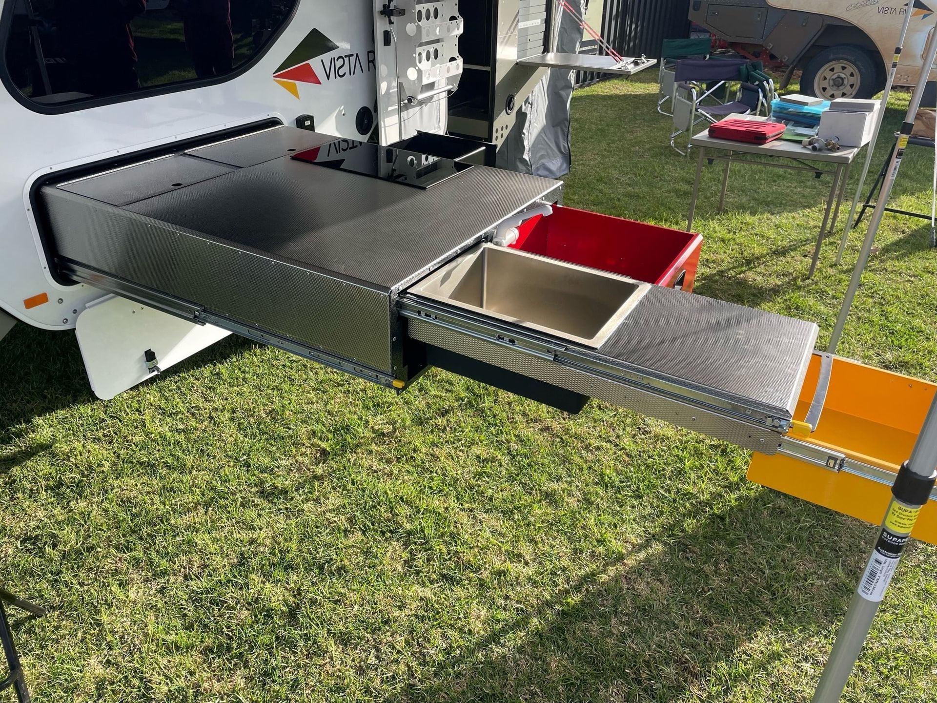 A camper trailer's outdoor pull-out kitchen.