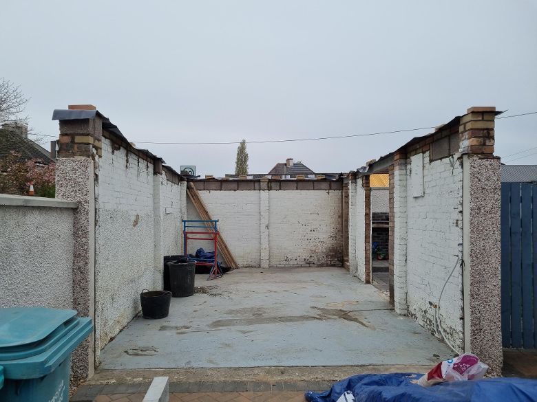 Picture of old detached garage being demolished before conversion
