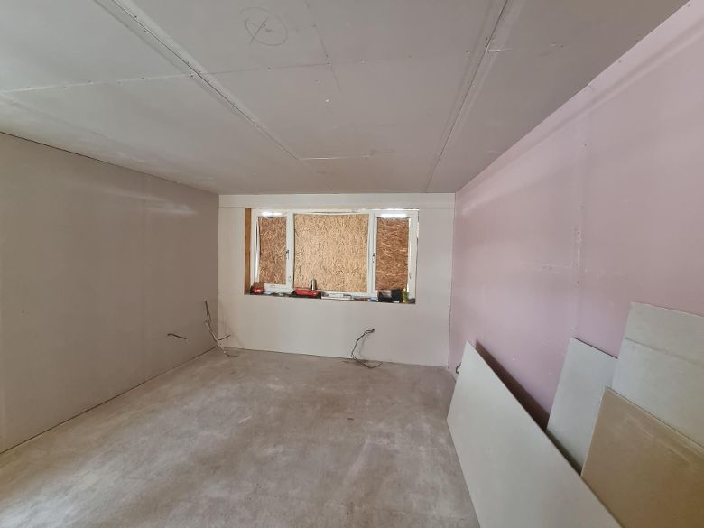internal garage room being plastered