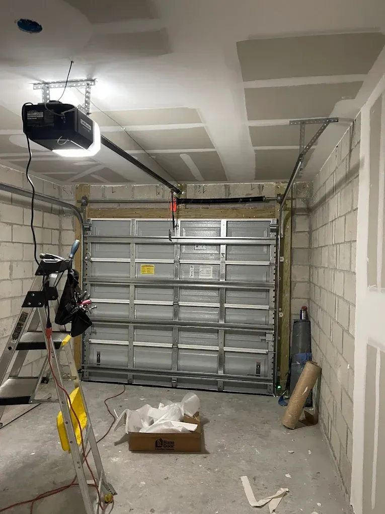 Air conditioning units with toolbox and gloves in backyard.
