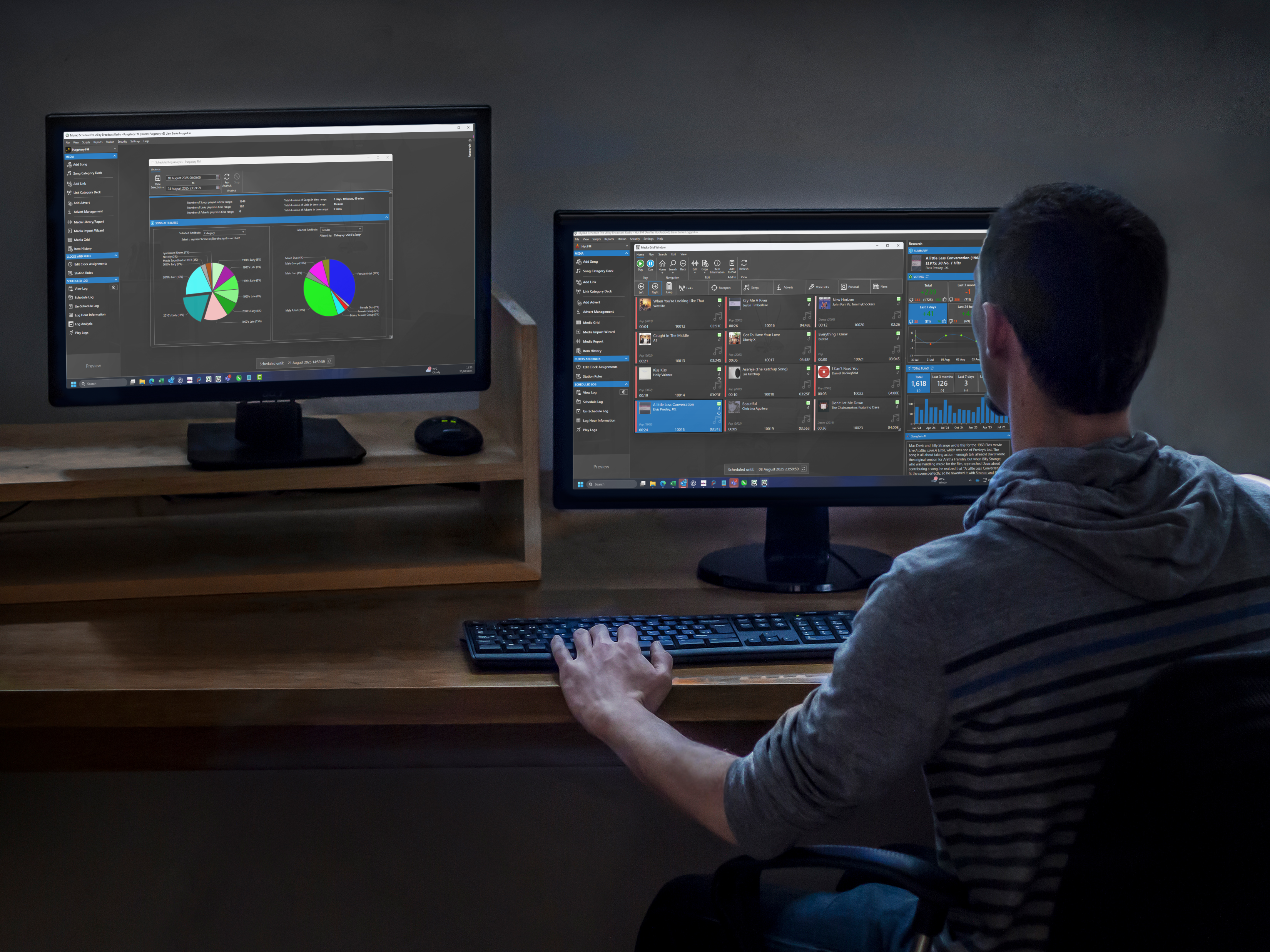 A radio professional uses working on Myriad Schedule Pro on a dual screen setup.